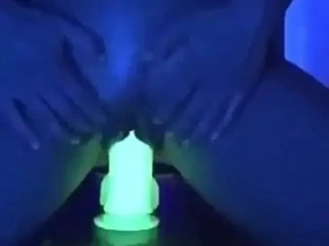 Riding glowing dildo